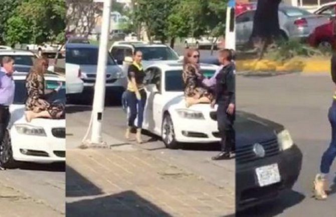 Žene na sve spremne: Popela se na auto suprugu kako bi odbranila svoj brak!(VIDEO)