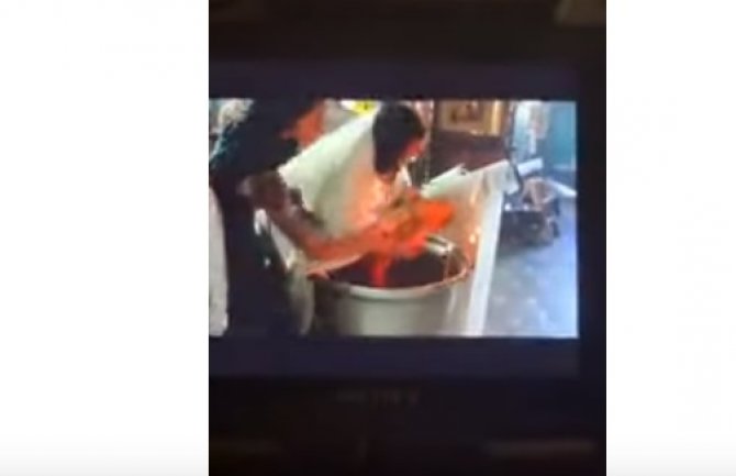 Sveštenik suspendovan: Beba tokom krštenja zadobila ogrebotine po vratu i ramenima(VIDEO)